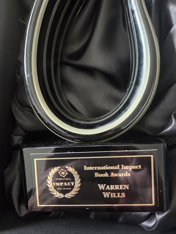 Warren Wills' International Impact Book Awards trophy